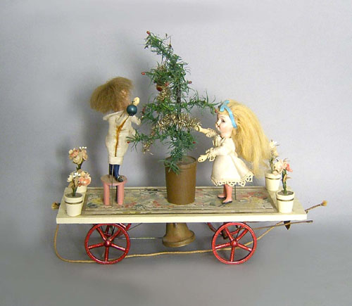 Appraisal: Animated Christmas pull toy early th c with composition doll