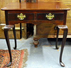 Appraisal: An th century mahogany lowboy the frieze with two drawers