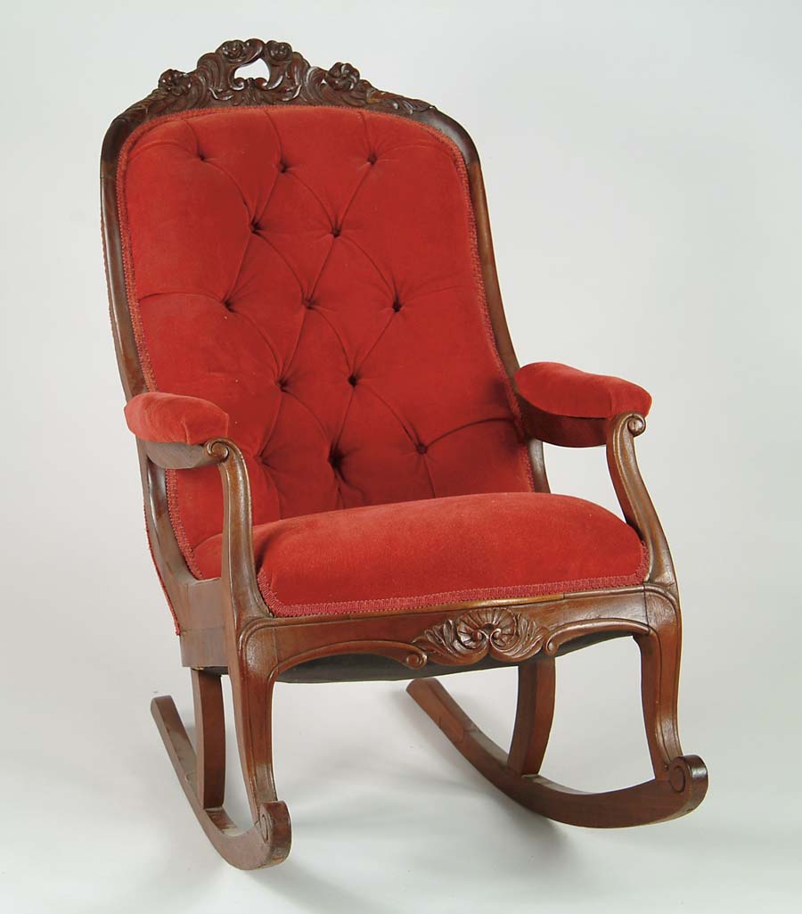 Appraisal: VICTORIAN CARVED OPEN ARM ROCKER Red tufted upholstered back with