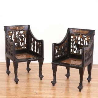 Appraisal: Pair Egyptian Revival gilt and ebonized armchairs Pair Egyptian Revival