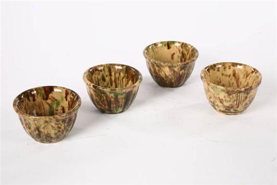 Appraisal: FOUR YELLOWWARE CUSTARD CUPS All with green and brown sponge