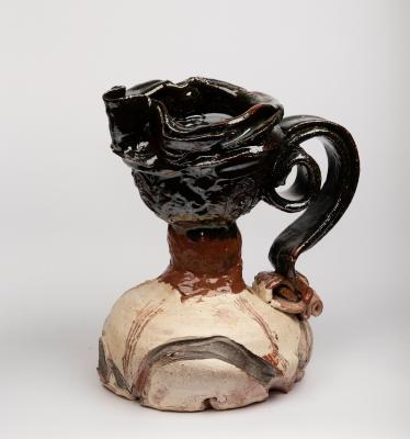 Appraisal: Simon Carroll - An earthenware jug with splayed base and