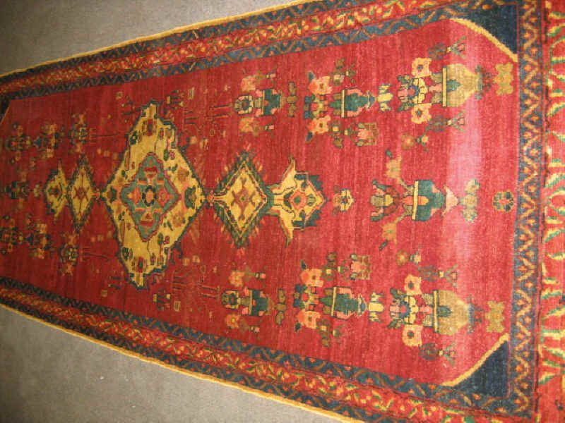 Appraisal: HAMADAN LONG RUG The red field of vase and floral