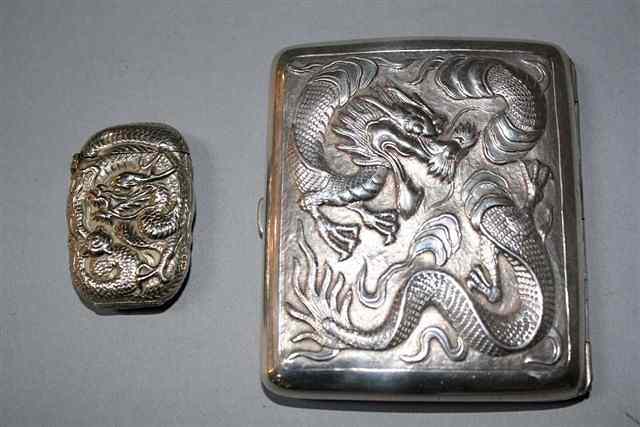 Appraisal: A SILVER CIGARETTE CASE with chased dragon decoration by Wang