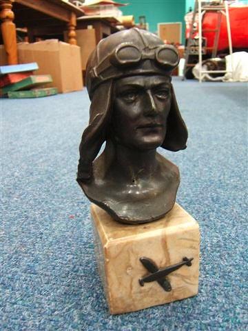 Appraisal: A BRONZE SPELTER HEAD OF A PILOT with goggles and