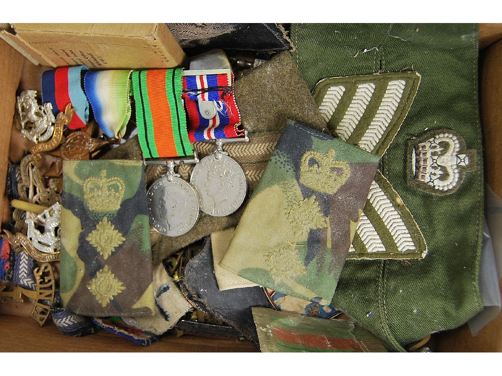 Appraisal: A box of military-related items including WW II medals metal