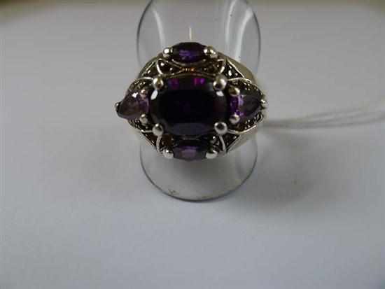 Appraisal: A PURPLE STONE DRESS RING IN STERLING SILVER