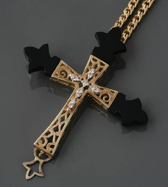 Appraisal: An onyx diamond and k gold cross pendant with chain