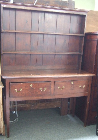 Appraisal: An th century and later oak dresser the enclosed two-tier