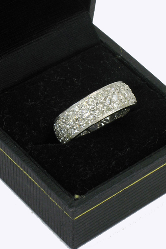 Appraisal: DIAMOND AND PLATINUM RING set with round-cut diamonds together weighing