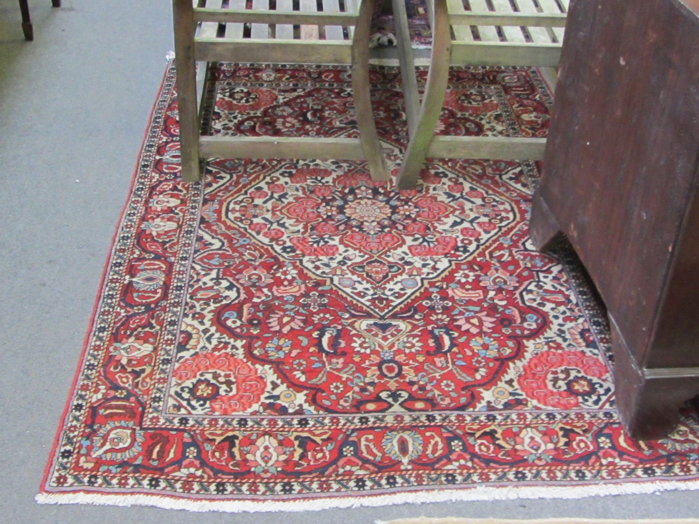 Appraisal: A Bakhtiari rug Persian the madder field with a bold