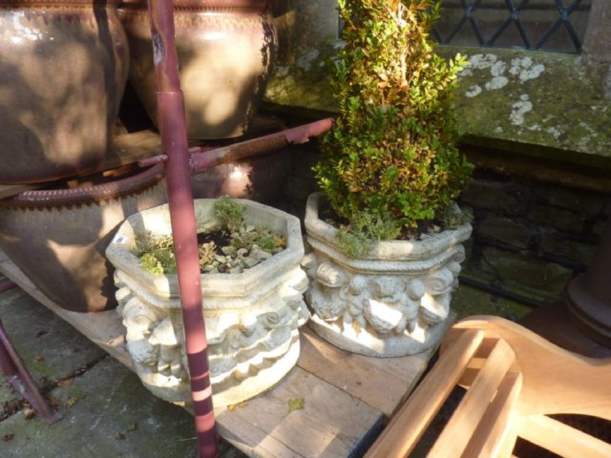 Appraisal: A pair of cast composition stone garden planters of octagonal