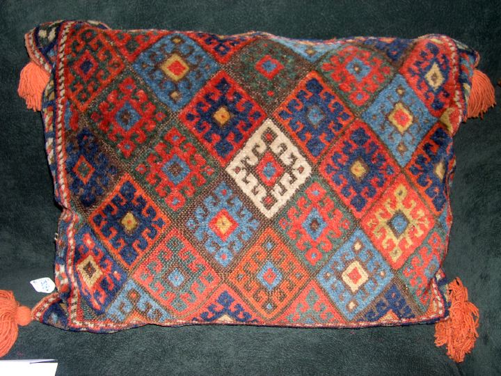 Appraisal: Oriental Carpet-Faced Sofa Pillow with orange-tasseled corner the back in