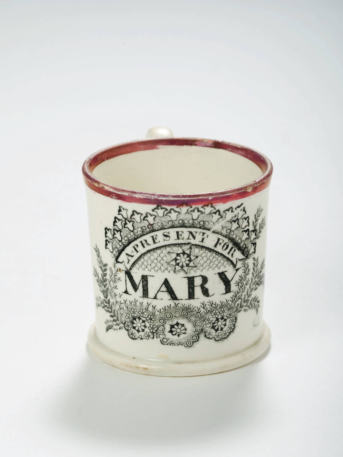 Appraisal: A PRESENT FOR MARY STAFFORDSHIRE PINK LUSTRE AND BLACK TRANSFER-PRINTED