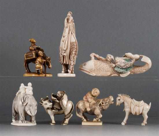 Appraisal: Four Japanese carved ivory netsukes and three similar figures netsukes