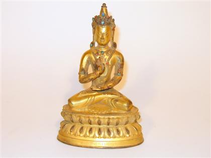 Appraisal: Sino-Tibetan gilt bronze and jeweled model of Buddha Seated over