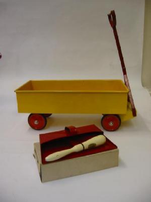 Appraisal: A pull-along truck yellow with red handle and four red