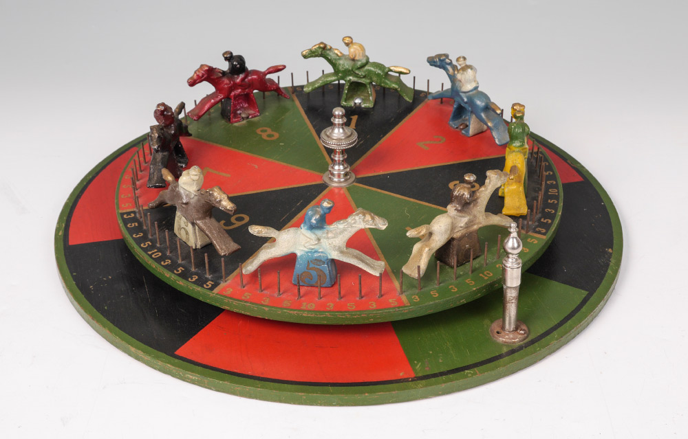 Appraisal: SPINNING HORSE RACE GAME WHEEL GAME painted metal horses on