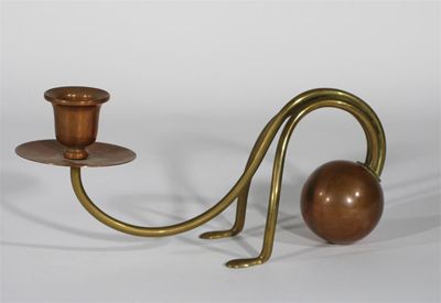 Appraisal: An Arts and Crafts copper and brass candlestick in the