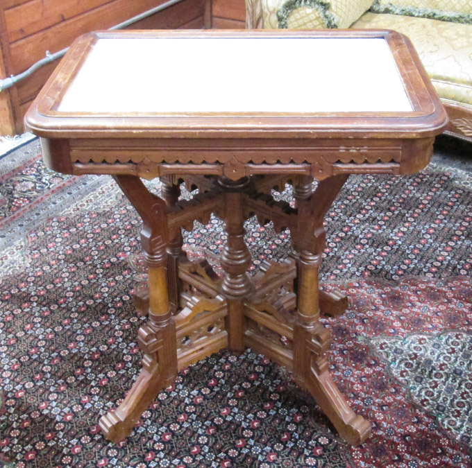 Appraisal: VICTORIAN MARBLE-TOP WALNUT LAMP TABLE Eastlake design American last quarter