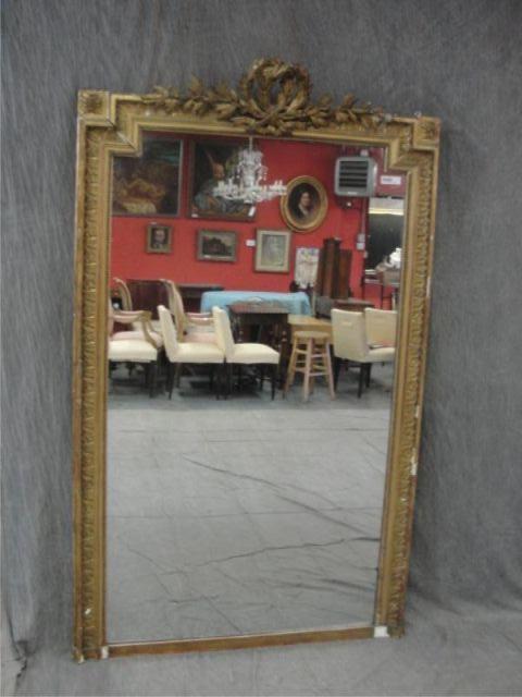 Appraisal: th Century Giltwood Mirror with Wreath Crown Slight losses From