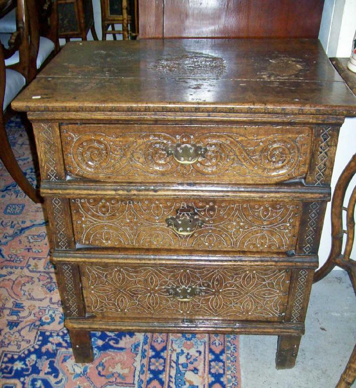 Appraisal: A th century carved oak chest of three drawers -