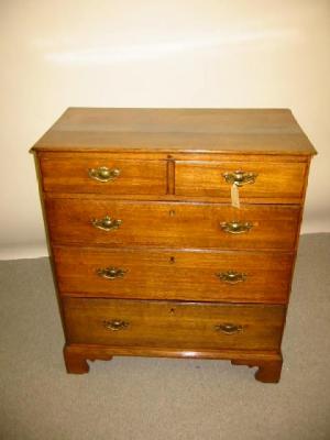 Appraisal: A GEORGE III OAK CHEST early th century moulded rounded