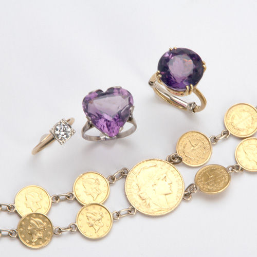 Appraisal: Gold coin bracelet and three k rings Bracelet composed of