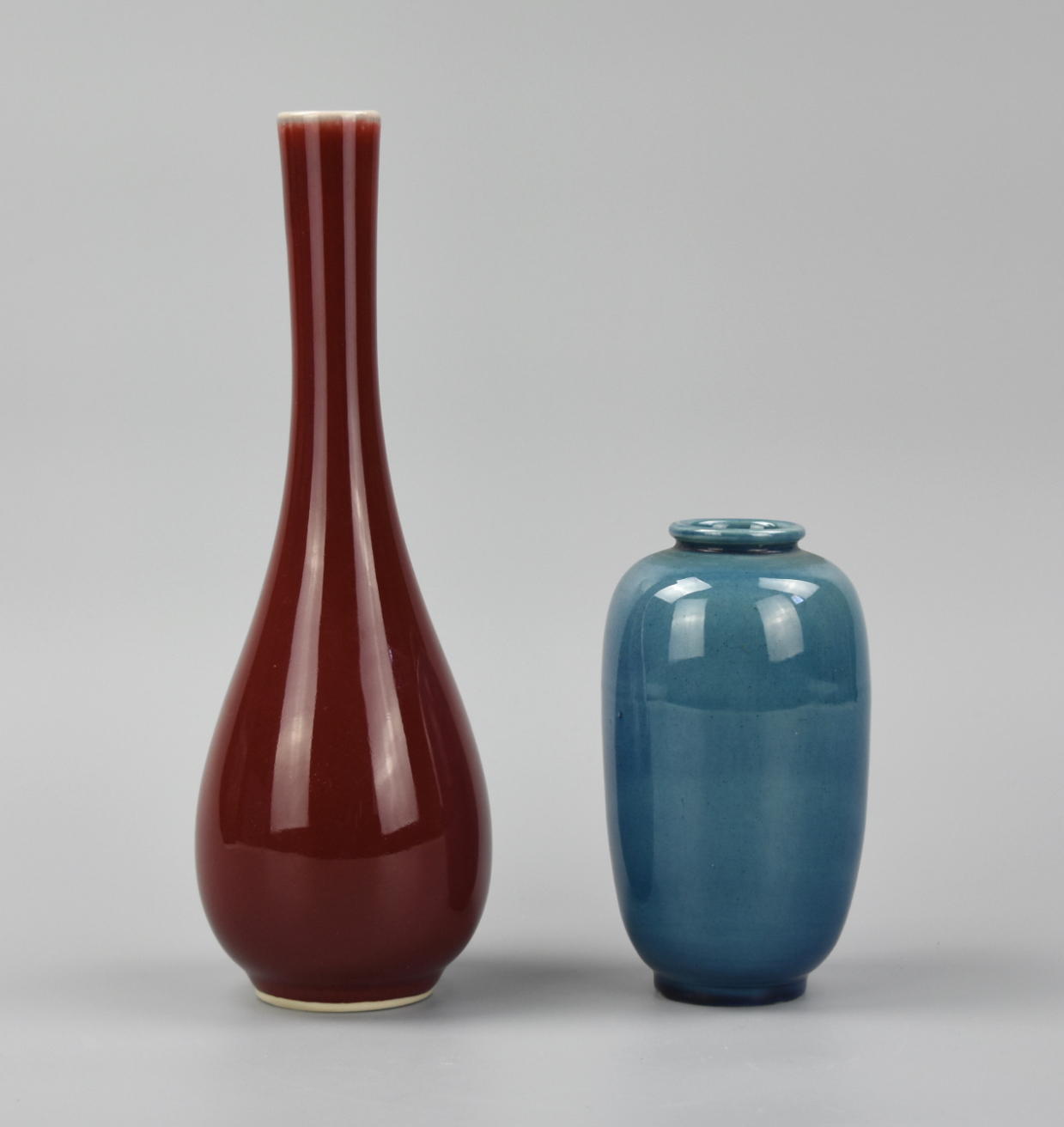 Appraisal: CHINESE RED AND A BLUE GLAZED VASE SET TH C