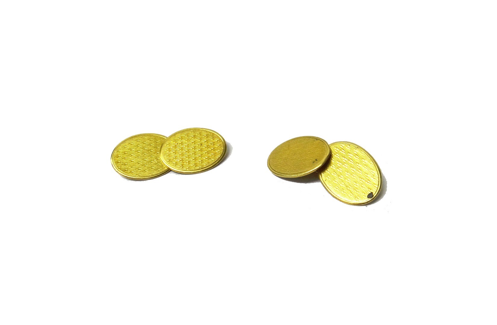 Appraisal: A pair of gold cufflinks the oval backs and fronts