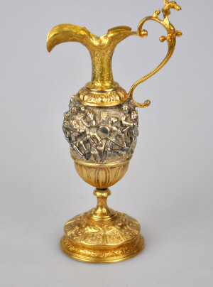 Appraisal: A gilt metal miniature ewer in the Baroque manner with