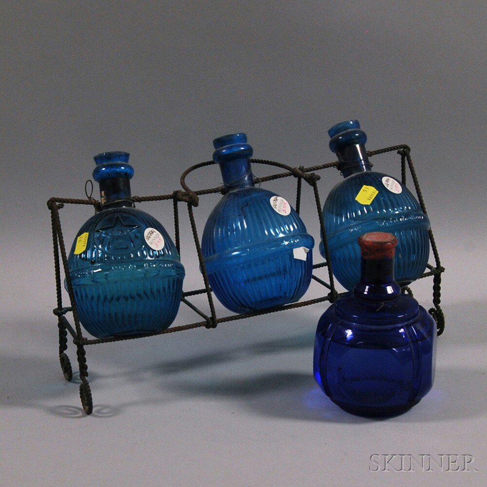 Appraisal: Four Blue Glass Fire Grenades th th century a set