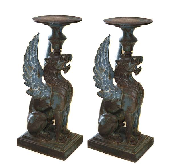 Appraisal: A pair of cast iron pedestals with griffin supports height