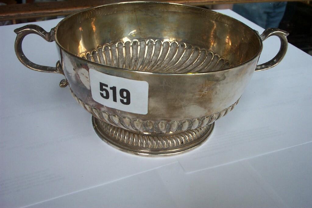 Appraisal: A Georgian silver open -handled bowl with half fluted body