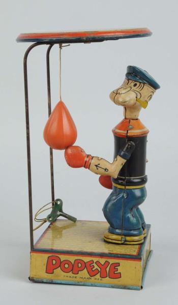 Appraisal: Shein Tin Litho Wind-Up Popeye Punching Toy Toy has original