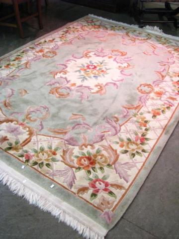 Appraisal: Chinese Area Rug lattice and floral motif with center medallion