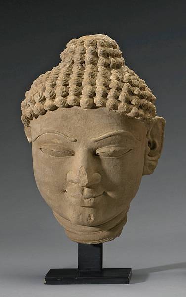 Appraisal: An Indian sandstone head of a Jina th Century The