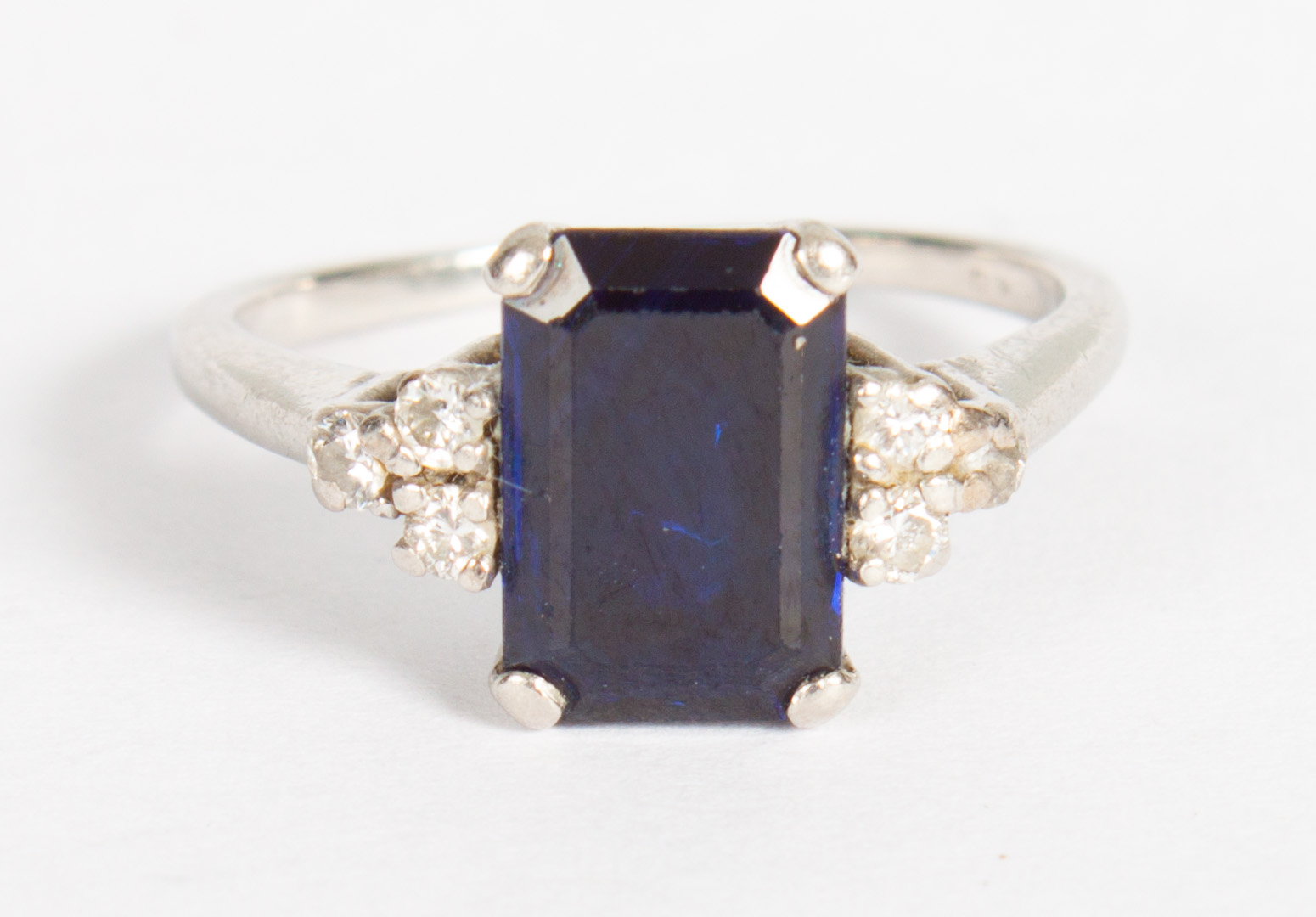 Appraisal: Lady's platinum sapphire and diamond ring emerald cut blue sapphire