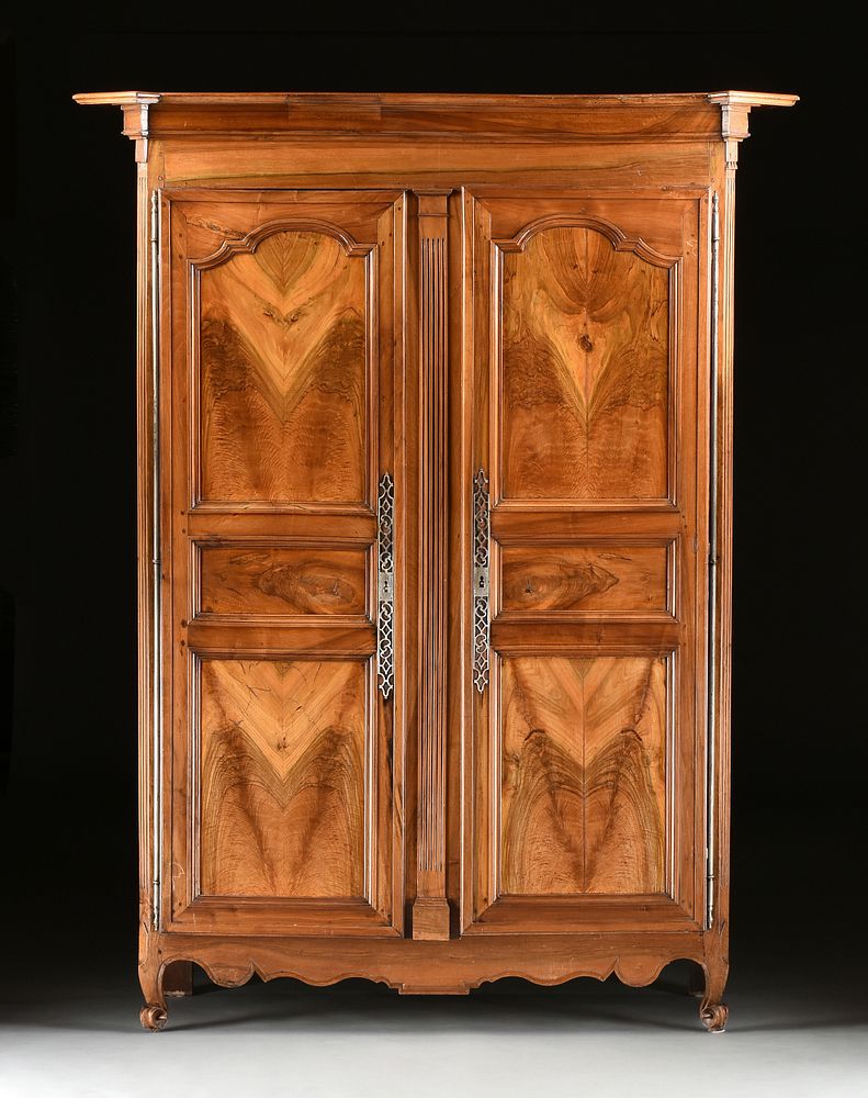 Appraisal: A LARGE FRENCH PROVINCIAL CARVED CHERRY ARMOIRE CIRCA A LARGE