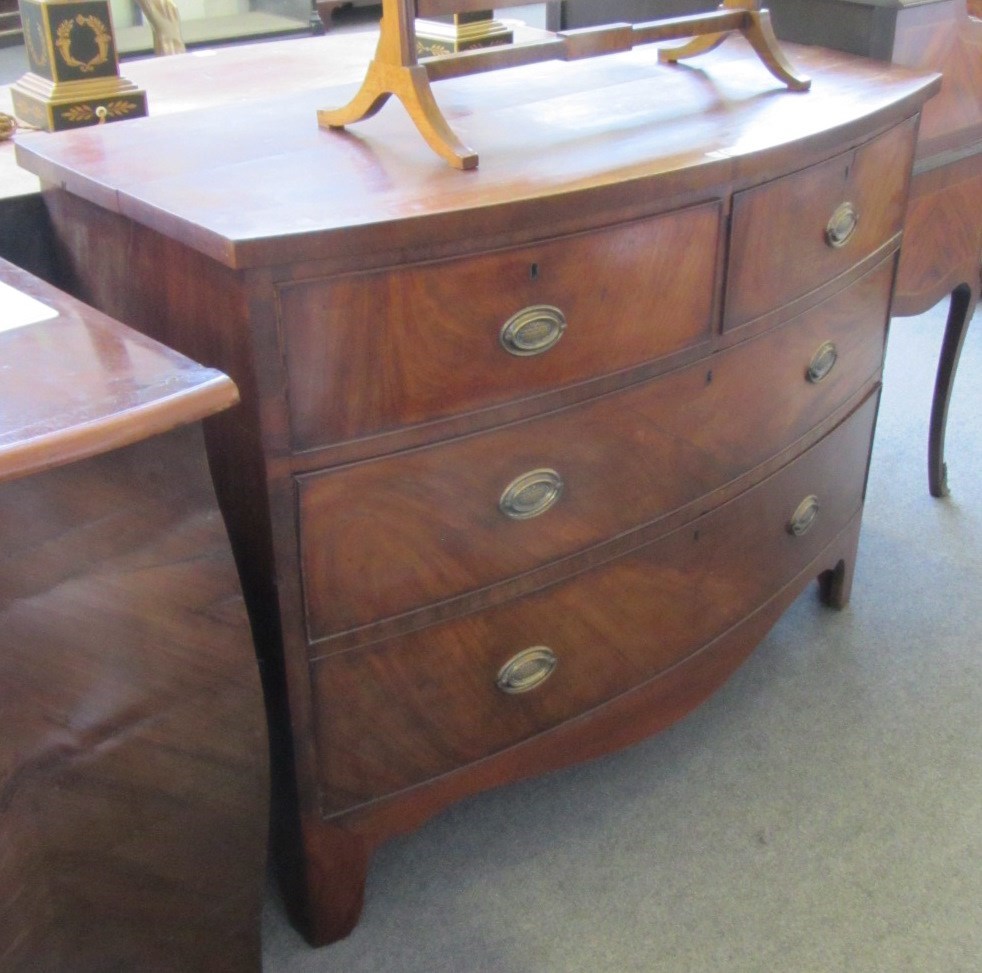 Appraisal: A Regency mahogany bowfront chest of two short and two