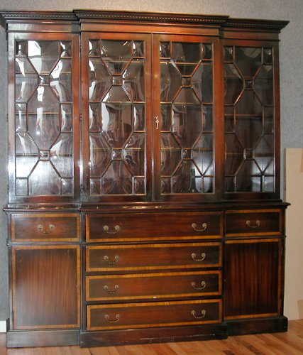 Appraisal: Artist Title Mahogany Chippendale style breakfront with satinwood inset upper