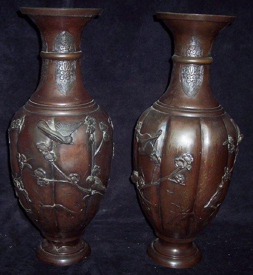 Appraisal: A pair of Japanese bronze vases circa decorated birds and