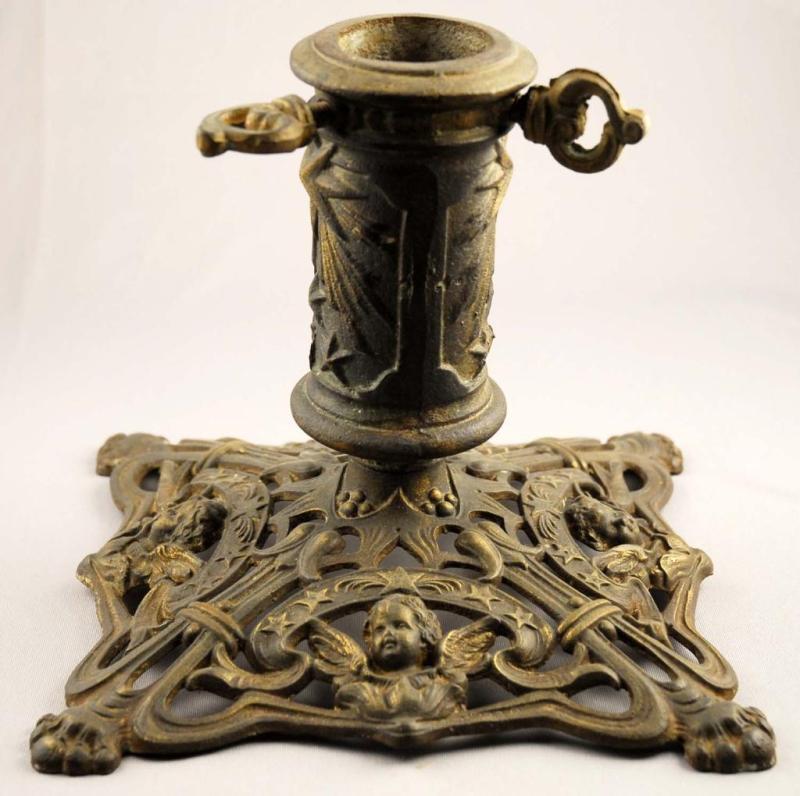 Appraisal: Cast Iron Christmas Tree Stand Description Circa Includes cherubs Condition