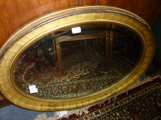 Appraisal: AN EARLY TH CENTURY OVAL GILT FRAMED MIRROR with bevelled