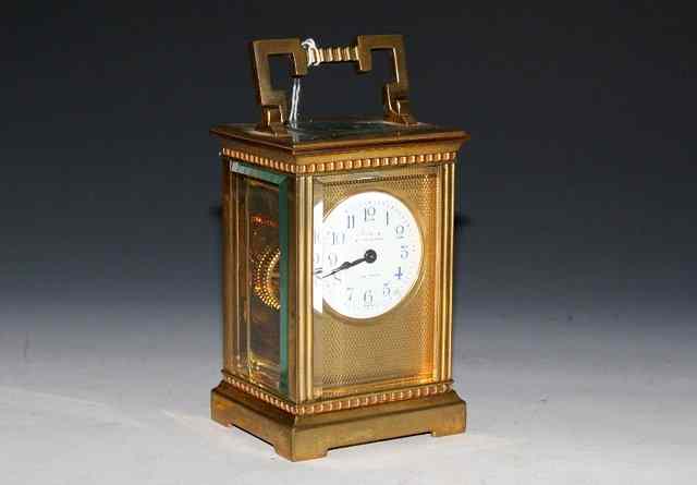 Appraisal: A FRENCH CARRIAGE TIMEPIECE with circular white enamel dial and