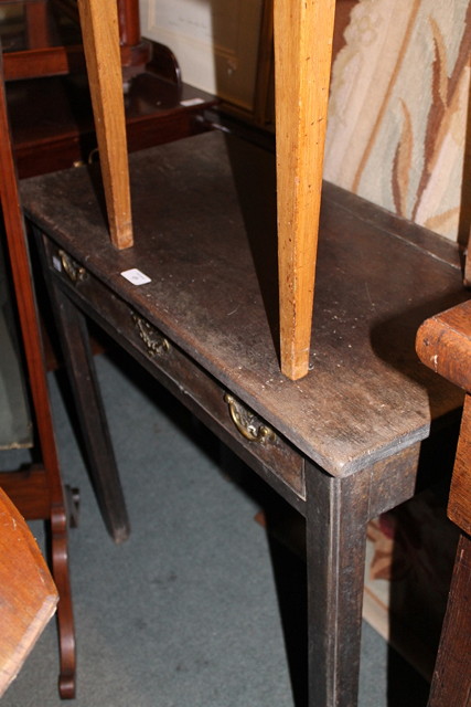 Appraisal: A GEORGIAN MAHOANY DROP FLAP TABLE fitted with single frieze