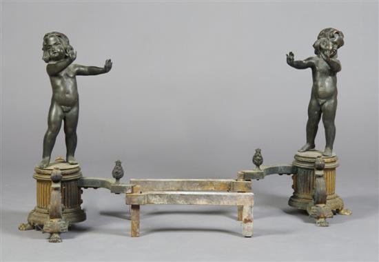 Appraisal: A Pair of Iron and Bronze Figural Andirons Height inches