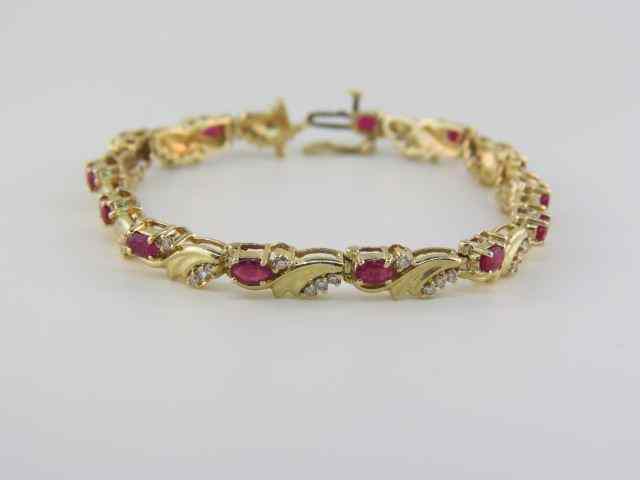 Appraisal: Ruby Diamond Bracelet oval rubies totaling carats and round diamonds