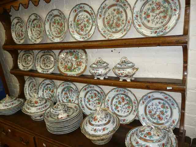 Appraisal: AN EXTENSIVE LATE VICTORIAN IRONSTONE DINNER SERVICE consisting of dinner