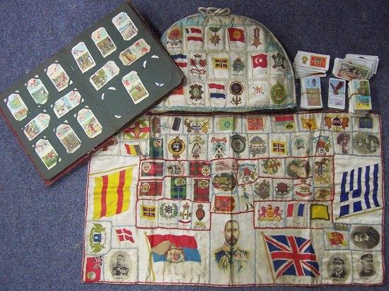 Appraisal: A tea cosy decorated silk cigarette cards and sundry cigarette